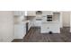 Modern kitchen featuring white cabinets, stainless steel appliances, and an island at 516 Lemon Daisy Ln, Knightdale, NC 27545