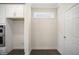Laundry room with built in cabinets and window at 516 Lemon Daisy Ln, Knightdale, NC 27545
