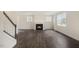 Spacious living room with a fireplace and hardwood floors at 516 Lemon Daisy Ln, Knightdale, NC 27545