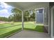 Screened porch with view of grassy backyard and neighboring house at 516 Lemon Daisy Ln, Knightdale, NC 27545