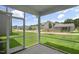 Screened porch overlooking the backyard and community at 516 Lemon Daisy Ln, Knightdale, NC 27545