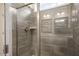 Shower with glass enclosure and gray tile at 516 Lemon Daisy Ln, Knightdale, NC 27545