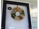 Front door adorned with a stylish dried floral wreath at 667 Bashford Rd, Raleigh, NC 27606
