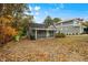 Charming gray house with a yellow door and covered porch at 1634 Crest Rd, Raleigh, NC 27606