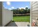 Small fenced backyard with green grass and a concrete patio at 1817 Hinesley Dr, Durham, NC 27703