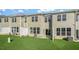 Row of townhouses with fenced yards, grassy lawns, and AC units at 1817 Hinesley Dr, Durham, NC 27703