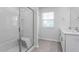Bright bathroom with double vanity, shower, and tub at 1819 Hinesley Dr, Durham, NC 27703