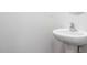 Small bathroom with pedestal sink and simple design at 1819 Hinesley Dr, Durham, NC 27703