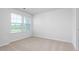 Bright bedroom with window and neutral decor at 1819 Hinesley Dr, Durham, NC 27703