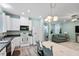 Modern kitchen with white cabinets and dark countertops at 3016 Remington Oaks Cir, Cary, NC 27519