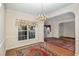 Bright dining room featuring hardwood floors and a large window at 3100 Lariat Ridge Dr, Wake Forest, NC 27587
