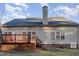 Rear view of house, showcasing a deck and wooded backdrop at 3100 Lariat Ridge Dr, Wake Forest, NC 27587