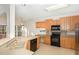Bright kitchen features ample cabinetry, an island, and modern appliances at 3100 Lariat Ridge Dr, Wake Forest, NC 27587