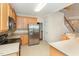 Kitchen with stainless steel appliances and light wood cabinets at 3100 Lariat Ridge Dr, Wake Forest, NC 27587