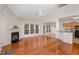 Open living area with hardwood floors, fireplace, and access to a deck at 3100 Lariat Ridge Dr, Wake Forest, NC 27587