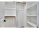 Bright walk-in closet with shelves and hanging rods at 406 Cherry St, Fuquay Varina, NC 27526