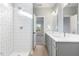 Modern bathroom with double vanity, large shower, and updated fixtures at 408 Cherry St, Fuquay Varina, NC 27526