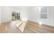 Bright bedroom with hardwood floors and sliding glass door to deck at 408 Cherry St, Fuquay Varina, NC 27526