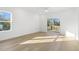 Bright bedroom with hardwood floors and sliding glass door to deck at 408 Cherry St, Fuquay Varina, NC 27526
