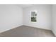 Bright bedroom with neutral carpeting and large window at 408 Cherry St, Fuquay Varina, NC 27526