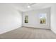 Spacious bedroom with carpet and ceiling fan at 408 Cherry St, Fuquay Varina, NC 27526