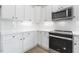 Modern kitchen with white cabinets and stainless steel appliances at 408 Cherry St, Fuquay Varina, NC 27526