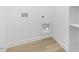 Convenient laundry area with hookups and shelving at 408 Cherry St, Fuquay Varina, NC 27526
