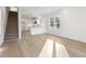 Open living room, hardwood floors, kitchen and staircase at 408 Cherry St, Fuquay Varina, NC 27526