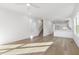 Open living room with hardwood floors and kitchen island at 408 Cherry St, Fuquay Varina, NC 27526