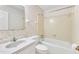 Bathroom with shower/tub combo and floral wallpaper at 503 Marshall Way, Durham, NC 27705
