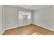 Spacious bedroom with light walls and hardwood flooring at 503 Marshall Way, Durham, NC 27705