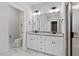Double sink bathroom with granite countertop and a walk-in shower at 652 Shawnee Dr, Louisburg, NC 27549
