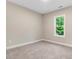 Well-lit bedroom with carpeted floors at 652 Shawnee Dr, Louisburg, NC 27549