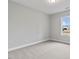 Bright bedroom featuring a large window and neutral decor at 652 Shawnee Dr, Louisburg, NC 27549