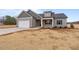 House exterior with a two-car garage and landscaping at 652 Shawnee Dr, Louisburg, NC 27549