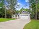 Two-story home with gray siding, two-car garage and landscaped lawn at 652 Shawnee Dr, Louisburg, NC 27549