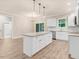 Open concept kitchen with white cabinets, granite counters, and island at 652 Shawnee Dr, Louisburg, NC 27549