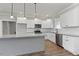 Modern kitchen with white cabinets and granite countertops at 652 Shawnee Dr, Louisburg, NC 27549