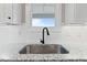 Modern kitchen sink with black faucet and granite countertop at 652 Shawnee Dr, Louisburg, NC 27549