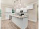 Open concept kitchen with white cabinets, granite counters, and island at 652 Shawnee Dr, Louisburg, NC 27549