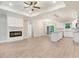 Open concept kitchen with white cabinets, granite counters, and island at 652 Shawnee Dr, Louisburg, NC 27549