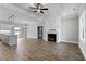 Open living room with hardwood floors and a fireplace at 652 Shawnee Dr, Louisburg, NC 27549