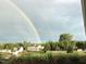 Double rainbow over homes and backyard at 7217 Blannie Farms Ln, Willow Springs, NC 27592
