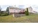 House's rear elevation, deck, and raised garden bed at 7217 Blannie Farms Ln, Willow Springs, NC 27592
