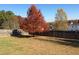 Backyard with large tree, fence, and green grass at 7217 Blannie Farms Ln, Willow Springs, NC 27592