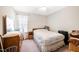 Second bedroom with a double bed, dresser, and window at 7217 Blannie Farms Ln, Willow Springs, NC 27592