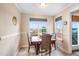 Bright dining area with wood table and chairs, plus window views at 7217 Blannie Farms Ln, Willow Springs, NC 27592