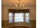 Dining room with bay window and chandelier at 7217 Blannie Farms Ln, Willow Springs, NC 27592