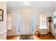Bright entryway with hardwood floors and coat rack at 7217 Blannie Farms Ln, Willow Springs, NC 27592
