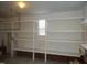 Garage with built-in shelving for storage at 7217 Blannie Farms Ln, Willow Springs, NC 27592